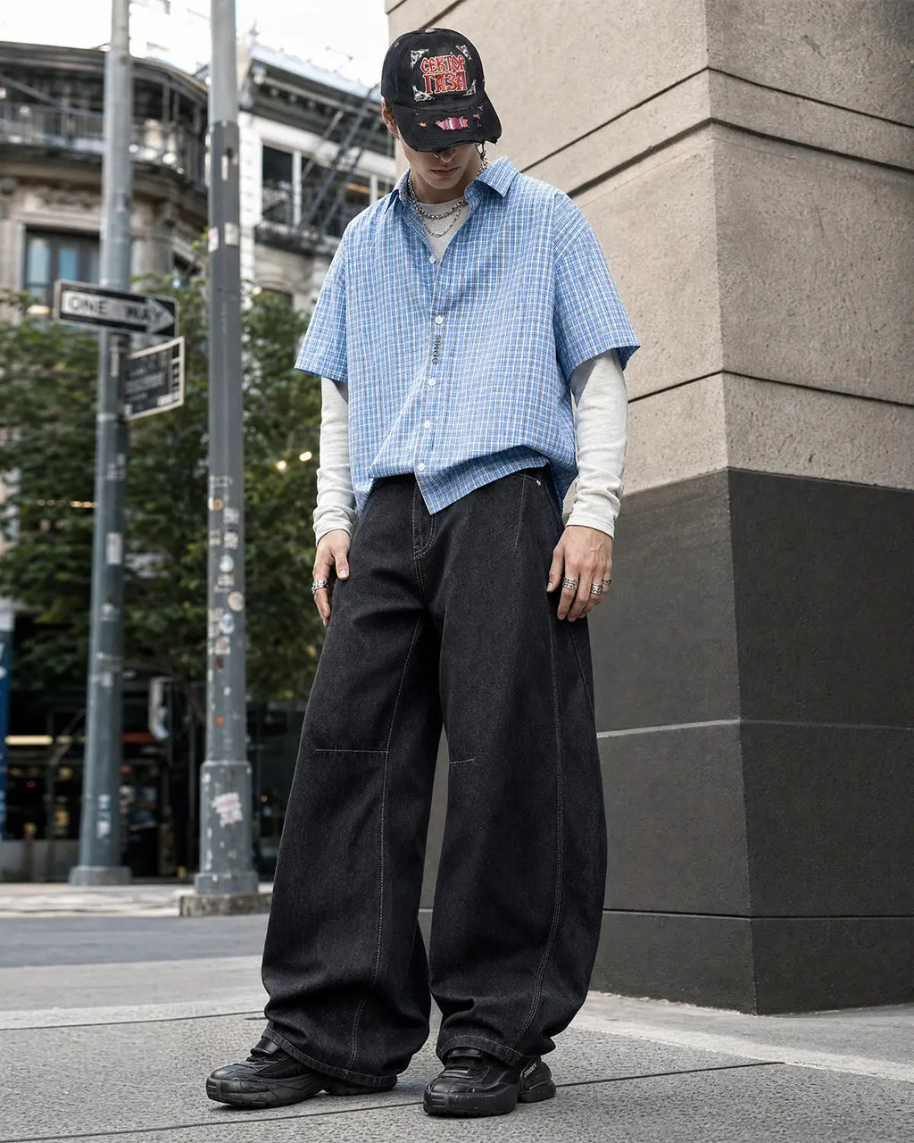 INFLATION Raw Color Barrel Baggy Jeans, casual pants with a relaxed fit and raw hem, in a dark denim wash.