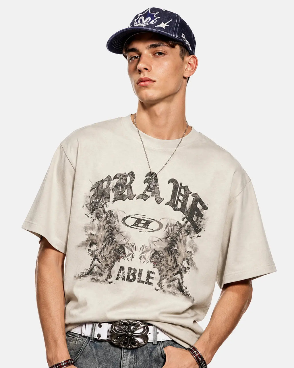 Graphic washed vintage oversized T-shirt by INFLATION with distressed print and relaxed fit, shown on a hanger.