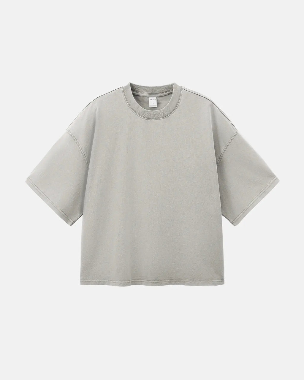 Distressed boxy washed T-shirt by INFLATION, featuring a relaxed fit with faded, vintage-inspired fabric and raw hem details.