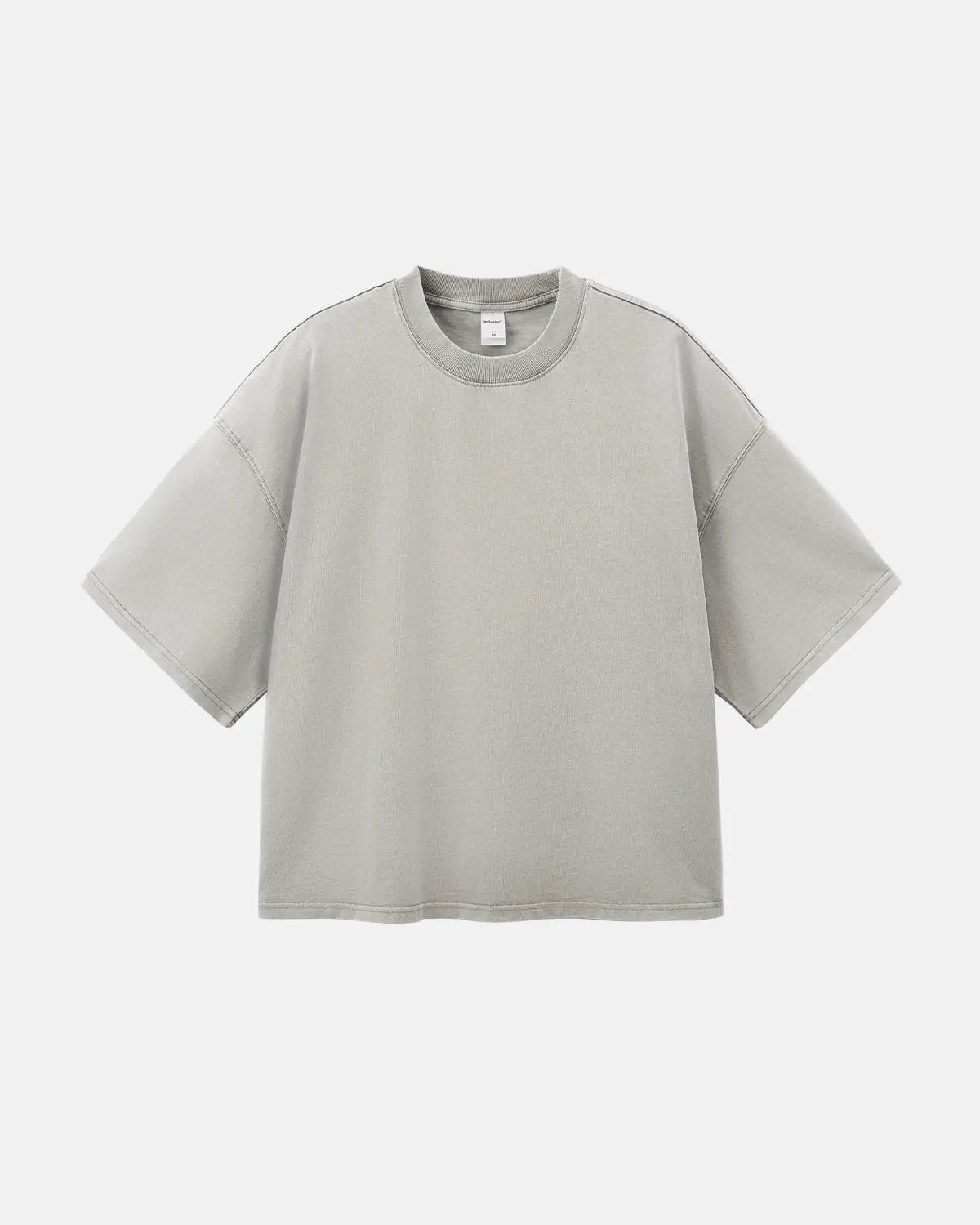 Distressed boxy washed T-shirt by INFLATION, featuring a relaxed fit with faded, vintage-inspired fabric and raw hem details.