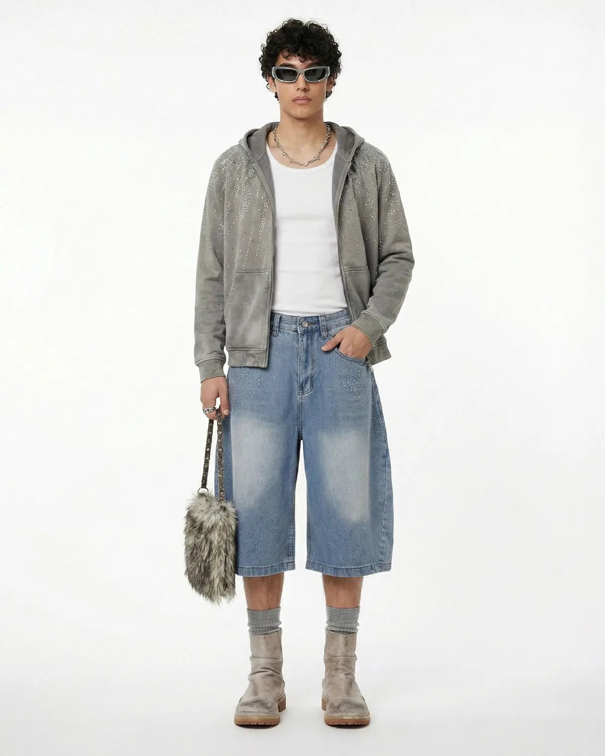 Star rhinestone longline denim shorts by INFLATION, stylish streetwear pants with sparkling star embellishments and a longline fit.