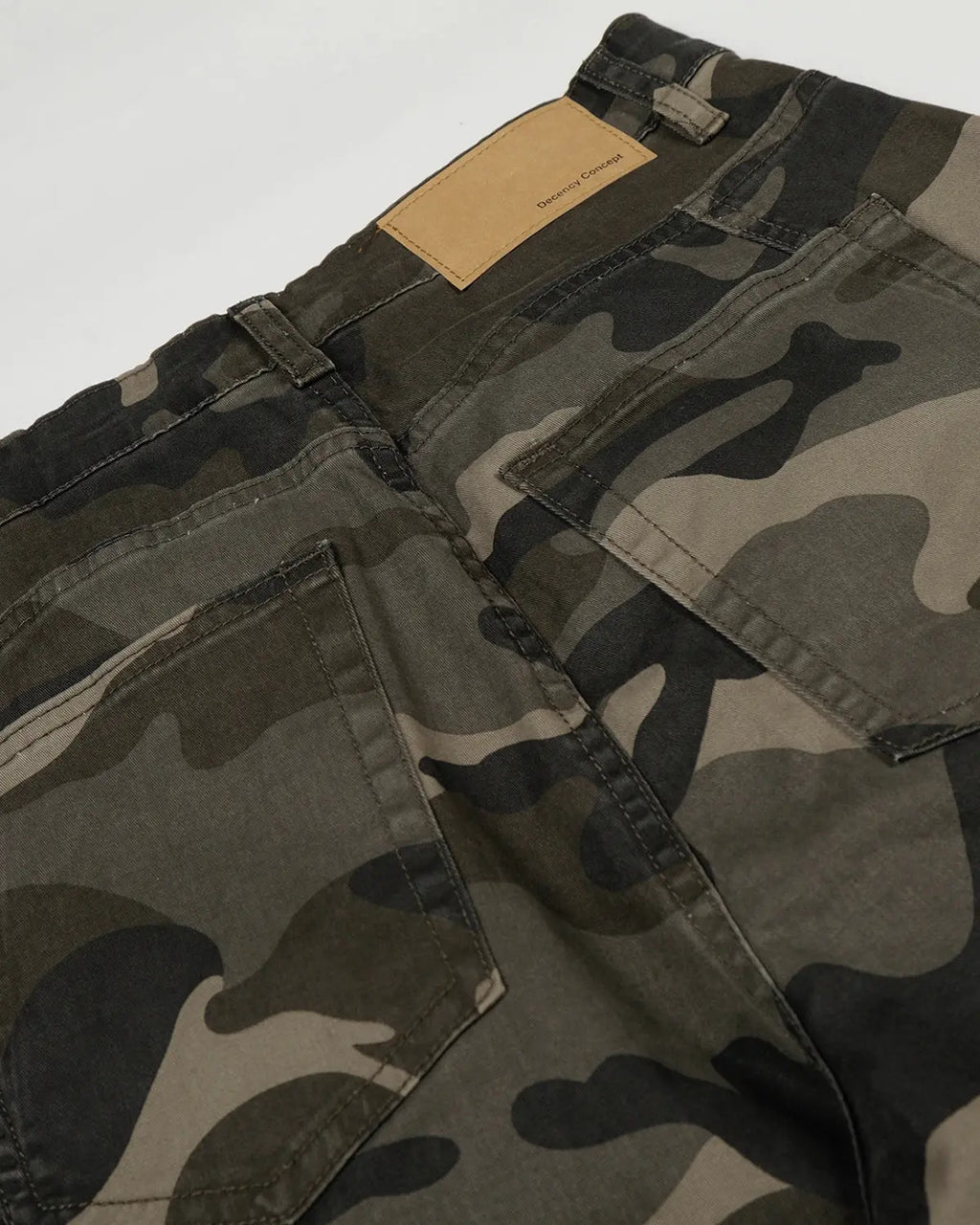 Multi-pockets camo barrel cargo pants by INFLATION featuring multiple storage pockets and a relaxed streetwear fit.