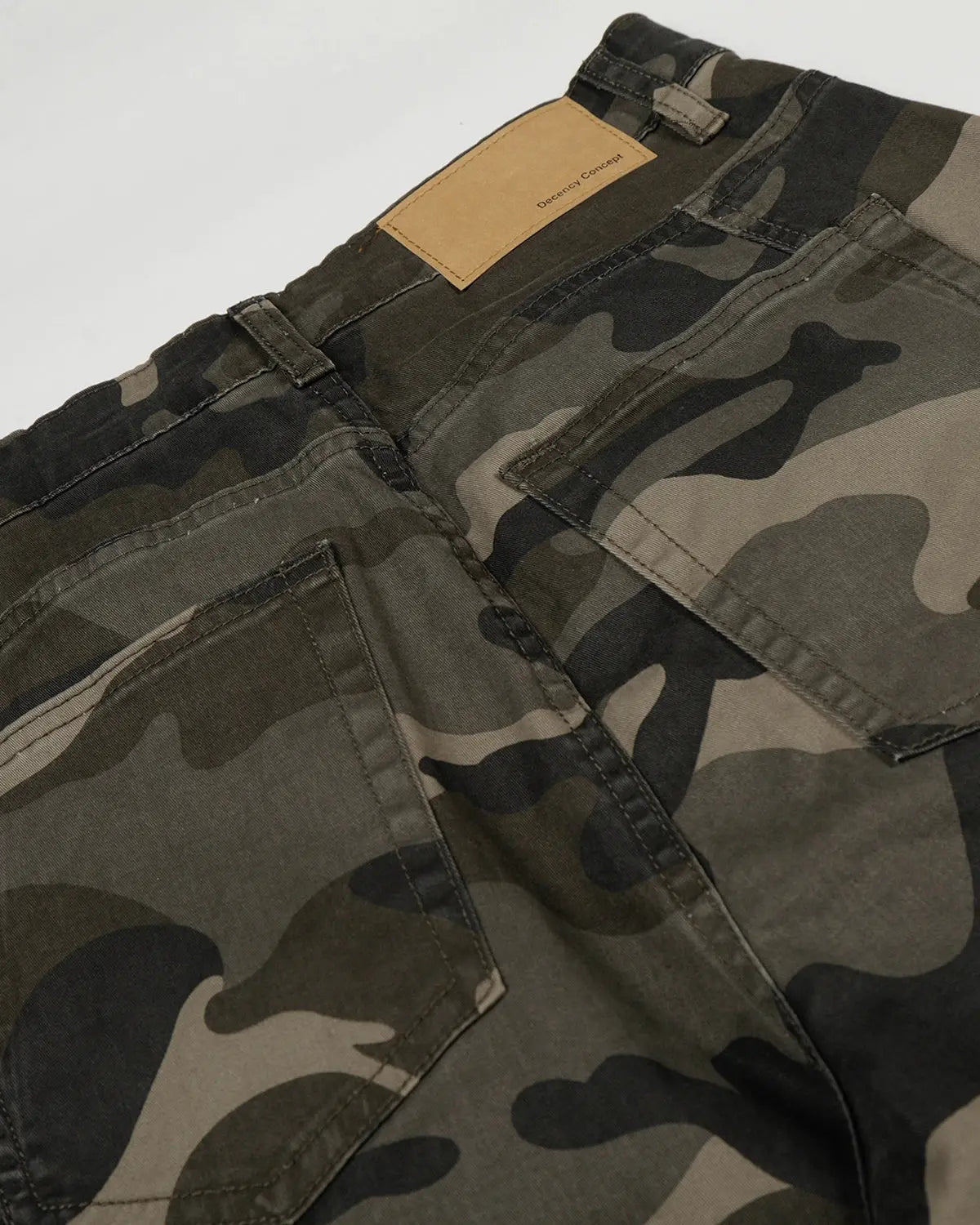 Multi-pockets camo barrel cargo pants by INFLATION featuring multiple storage pockets and a relaxed streetwear fit.