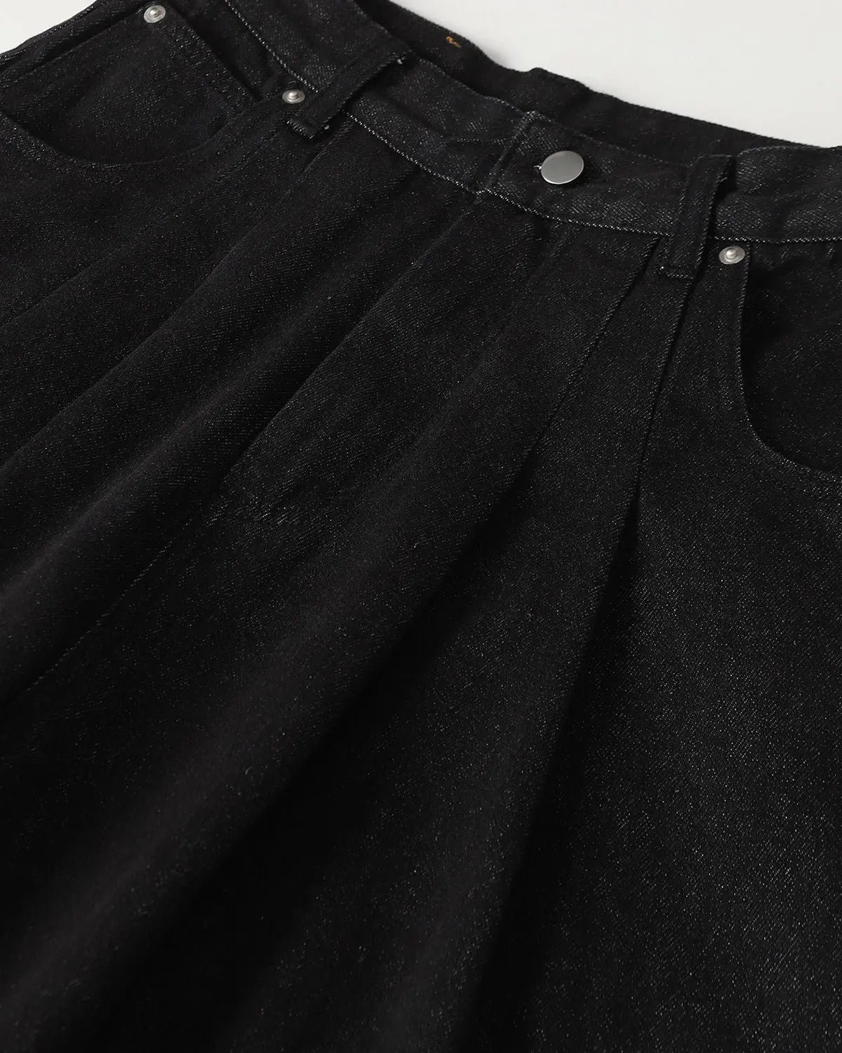 Inflation Streetwear heavyweight baggy raw wide-leg jeans, showing the relaxed fit and distressed denim texture.