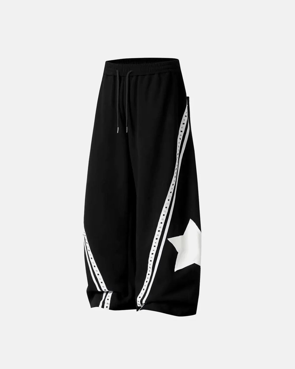 Contrast patchwork barrel sweatpants by INFLATION featuring bold color blocks and relaxed fit, shown on a model.