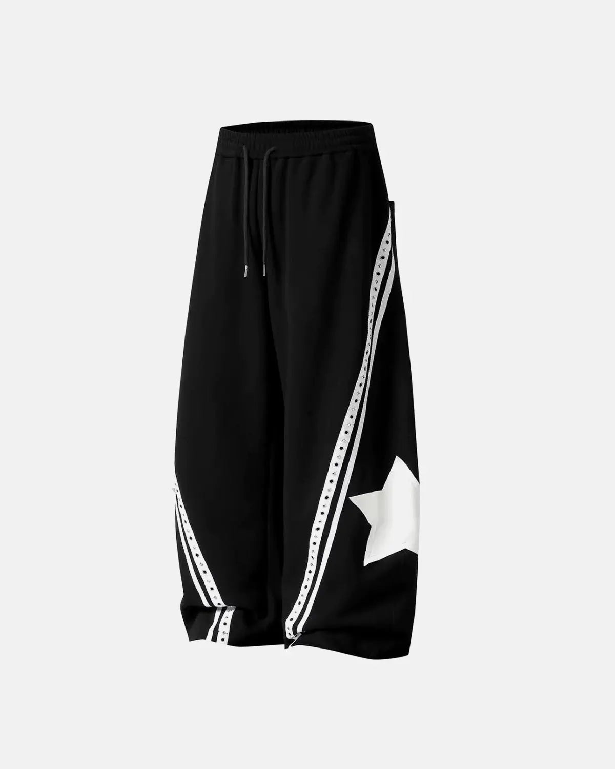 Contrast patchwork barrel sweatpants by INFLATION featuring bold color blocks and relaxed fit, shown on a model.