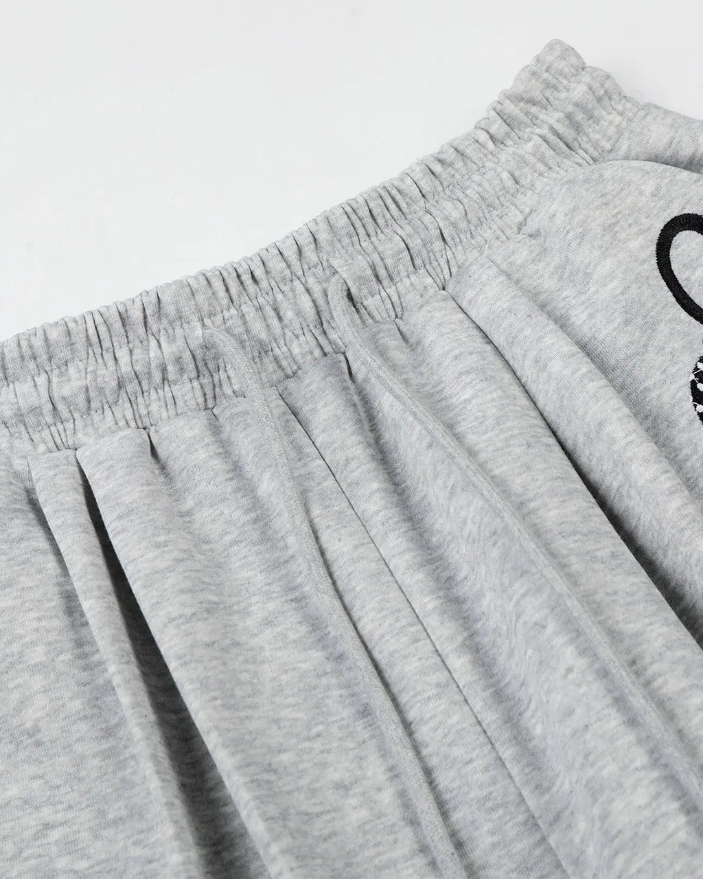Inflation Streetwear Applique Baggy Sweatpants with bold patch details and relaxed fit, made from comfortable fabric.
