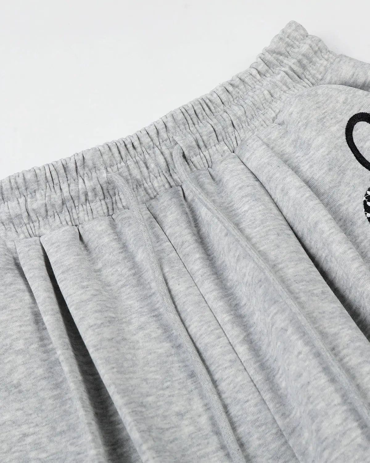 Inflation Streetwear Applique Baggy Sweatpants with bold patch details and relaxed fit, made from comfortable fabric.