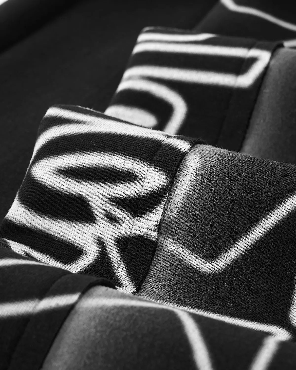 Inflation Streetwear Stitching Spray-Painted Graffiti Sweatpant with colorful spray paint design and stitching details.