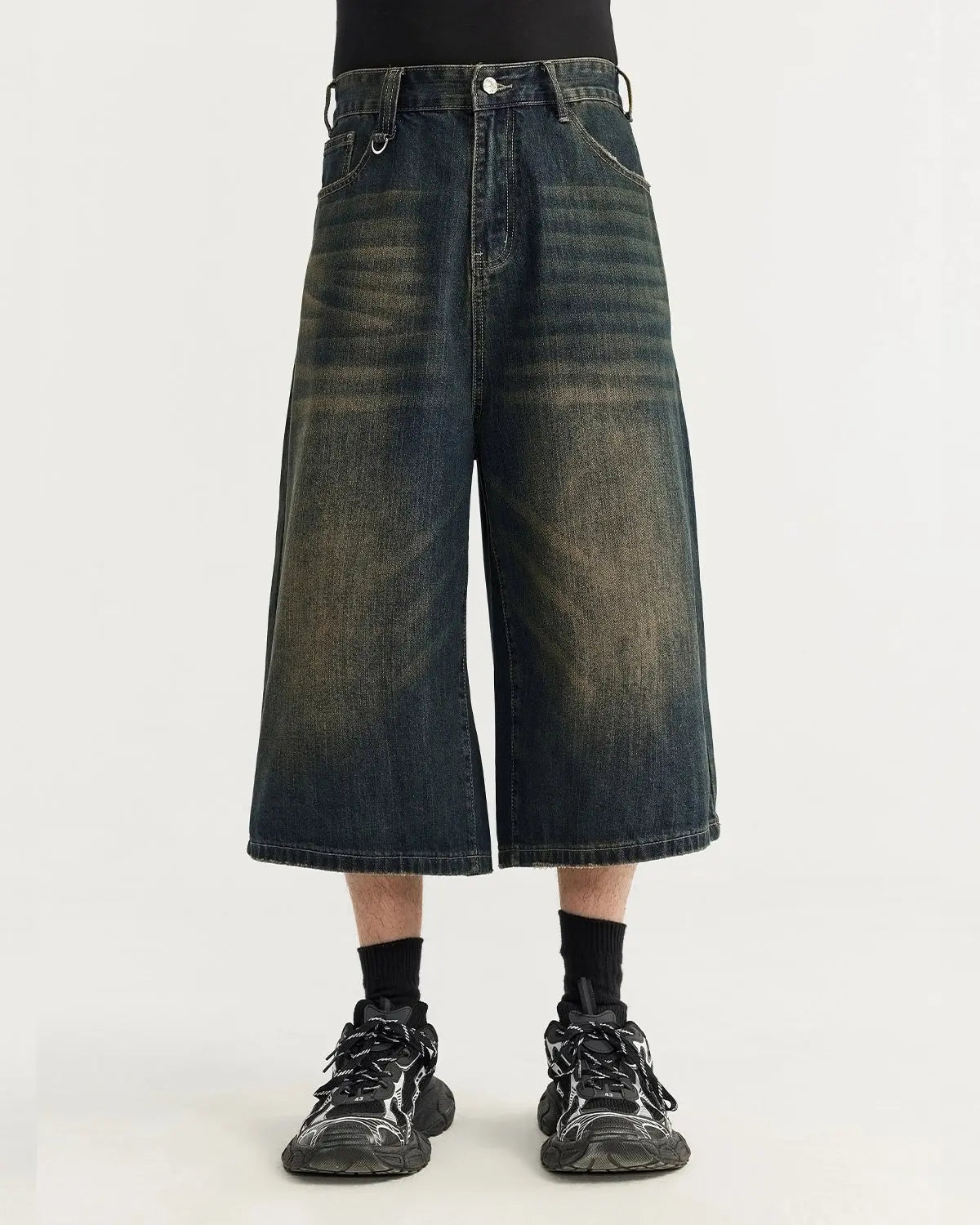 Acid washed longline baggy denim jorts by INFLATION, casual streetwear pants with a relaxed fit and distressed detailing.