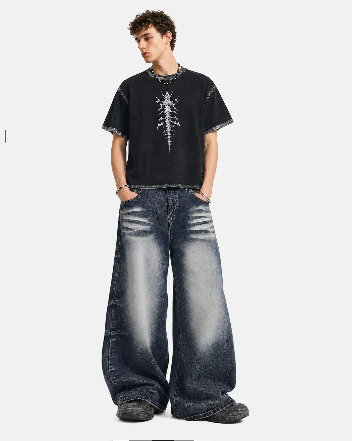 Light blue faded Whisker Baggy Jeans by INFLATION Streetwear featuring distressed details and relaxed fit on a model.