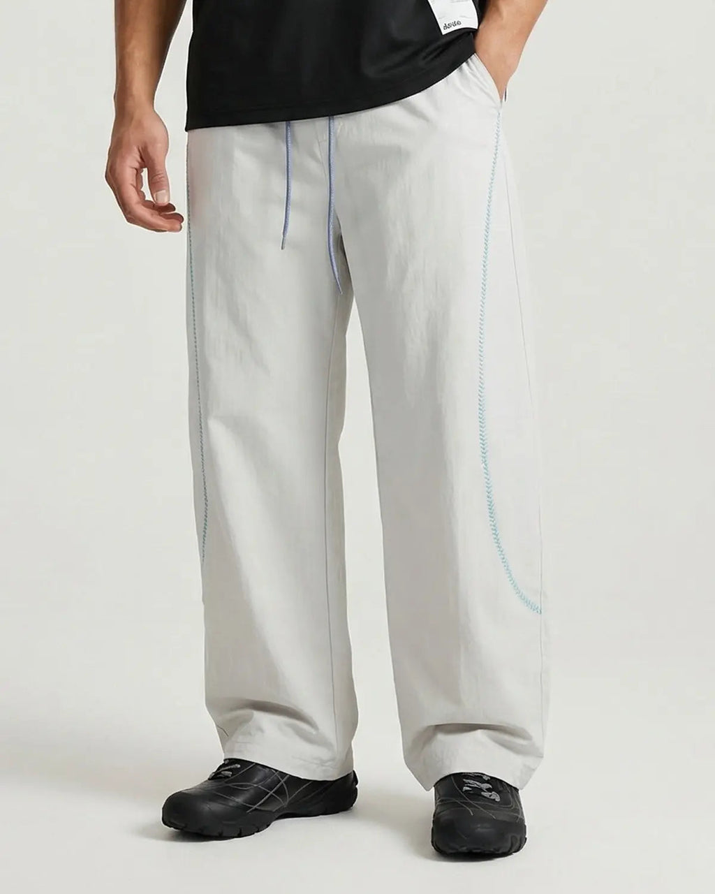 INFLATION AirFlow Contrast Embroidered Track Pants featuring stylish embroidery and breathable fabric for athletic comfort.