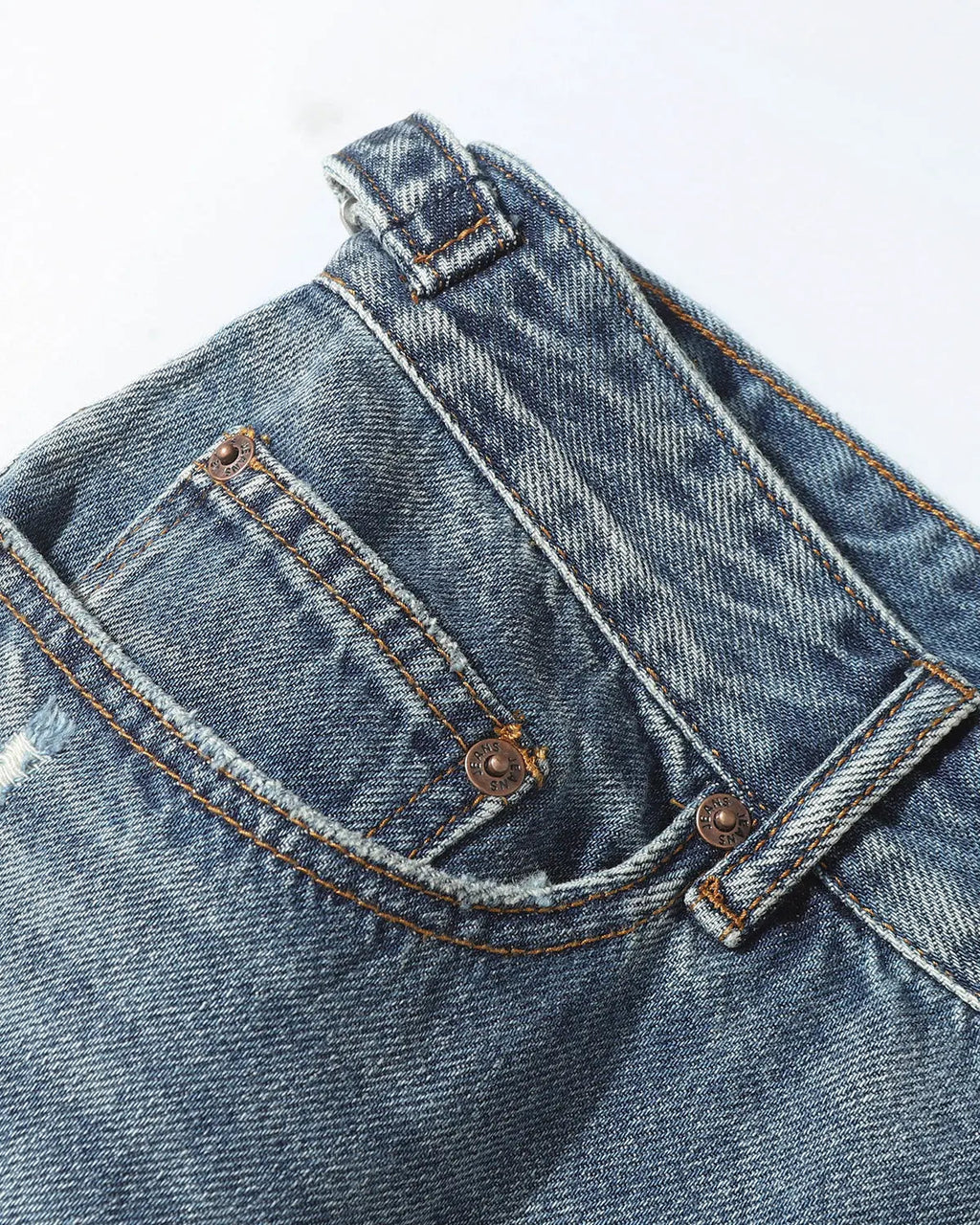 Distressed baggy jorts by INFLATION with adjustable waist tabs, casual streetwear pants, featuring a relaxed fit and frayed edges.