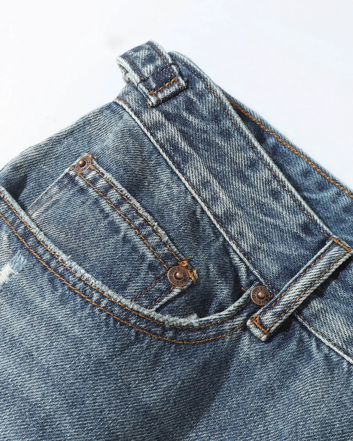 Distressed baggy jorts by INFLATION with adjustable waist tabs, casual streetwear pants, featuring a relaxed fit and frayed edges.