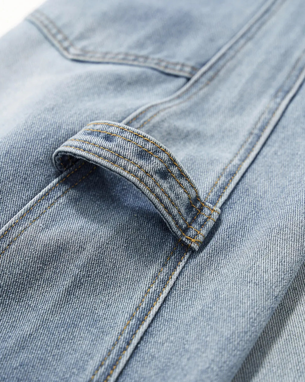 Distressed baggy cargo jeans by INFLATION featuring a relaxed fit, multiple pockets, and a rugged streetwear style.