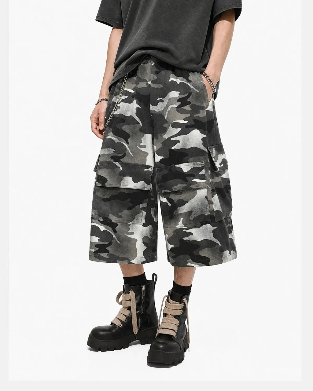 Grey camo utility longline shorts by INFLATION, featuring multiple pockets and a relaxed streetwear style.
