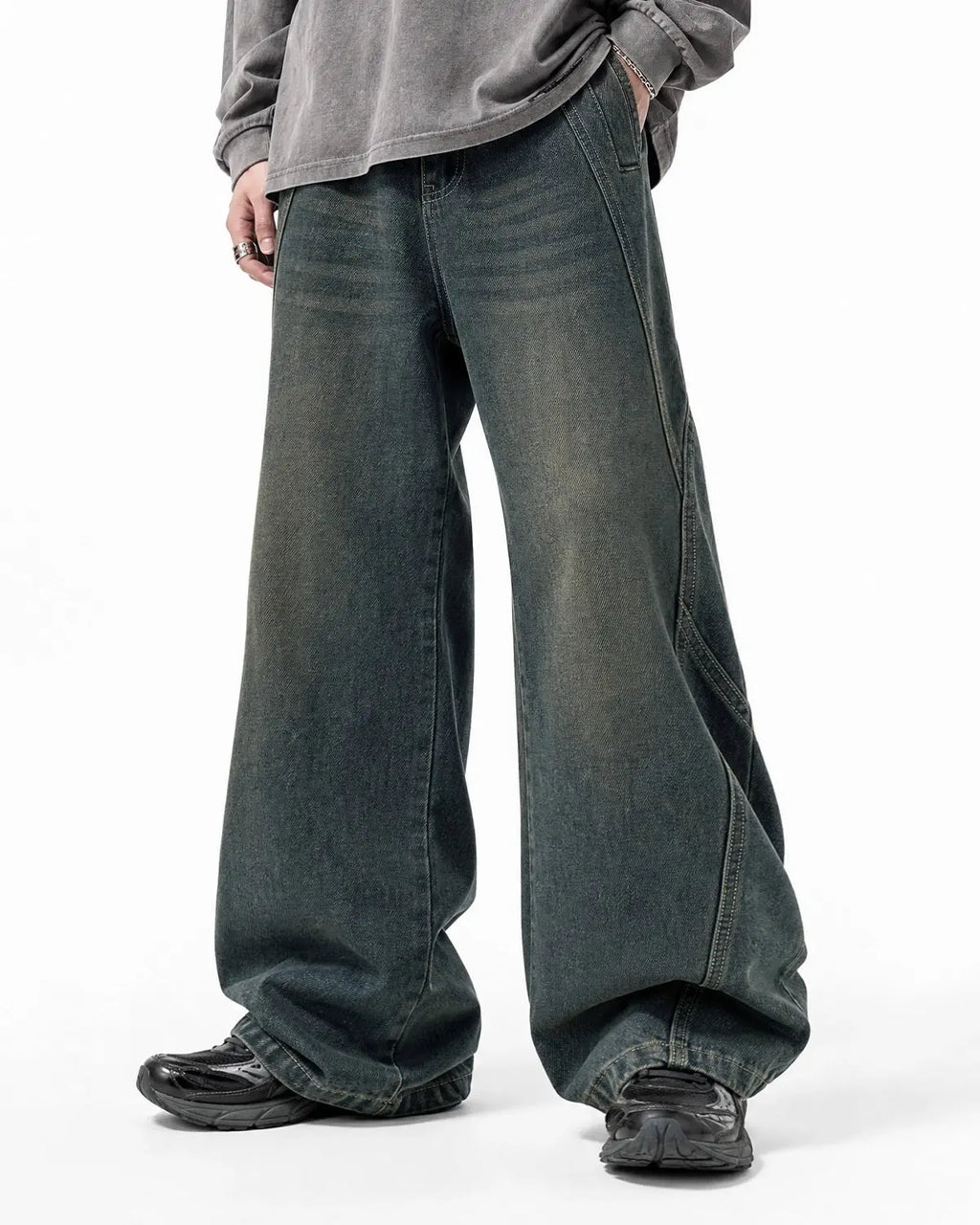 Deconstructed straight-leg jeans by INFLATION, showcasing distressed denim and unique cut details on casual pants.