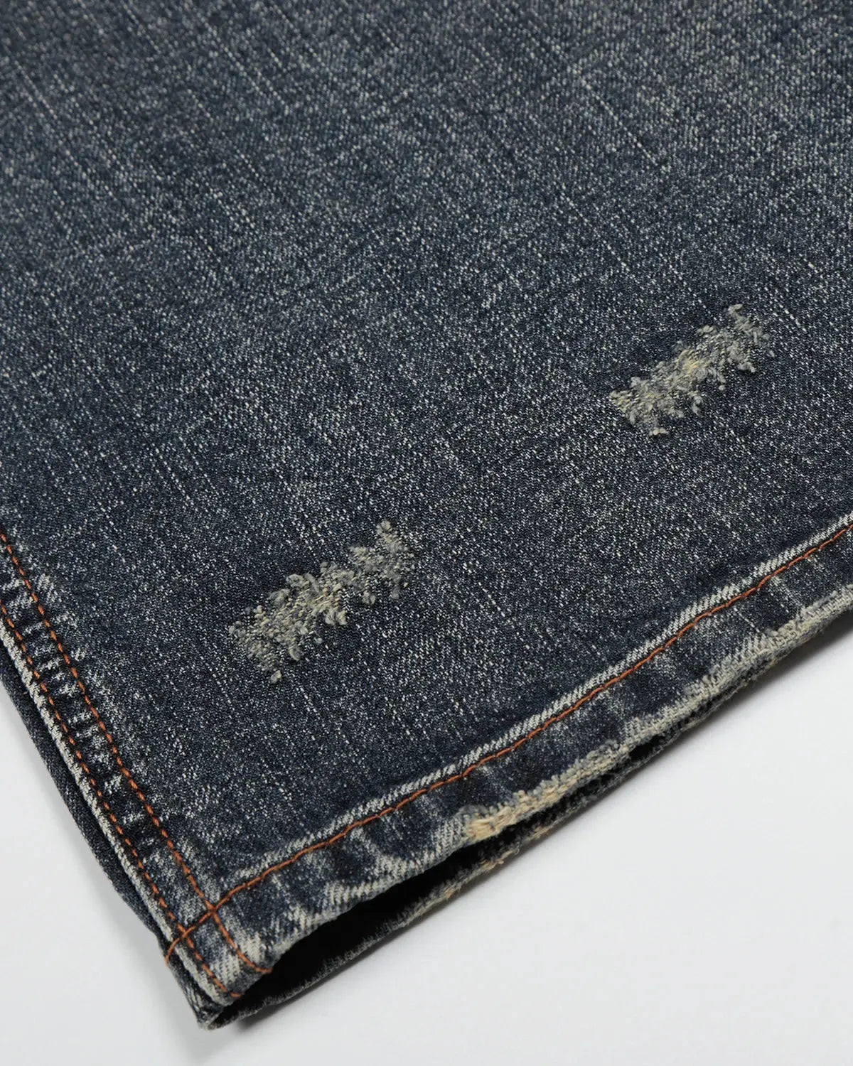 Faded Whisker Baggy Jeans by INFLATION featuring relaxed fit, distressed denim, and streetwear style in a light wash.