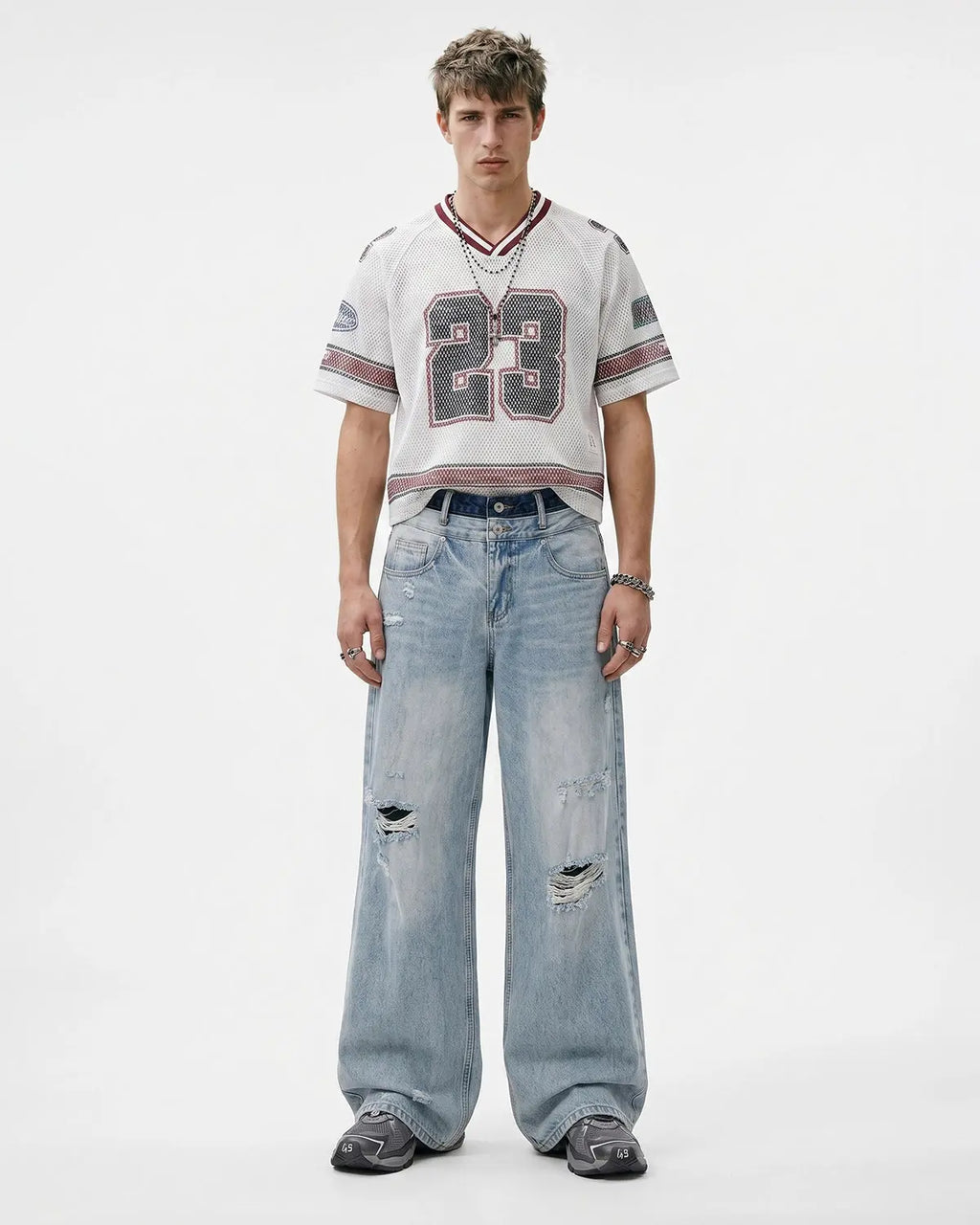 Distressed double waist baggy jeans by INFLATION Streetwear featuring relaxed fit and ripped details, casual streetwear style.