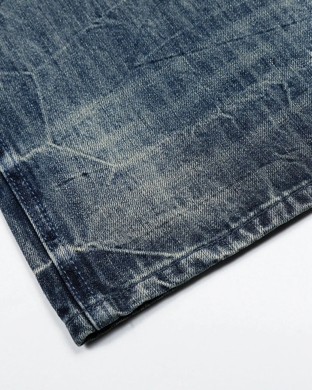 Inflation Streetwear textured wash baggy jeans with relaxed fit, featuring a faded denim look and distressed details.