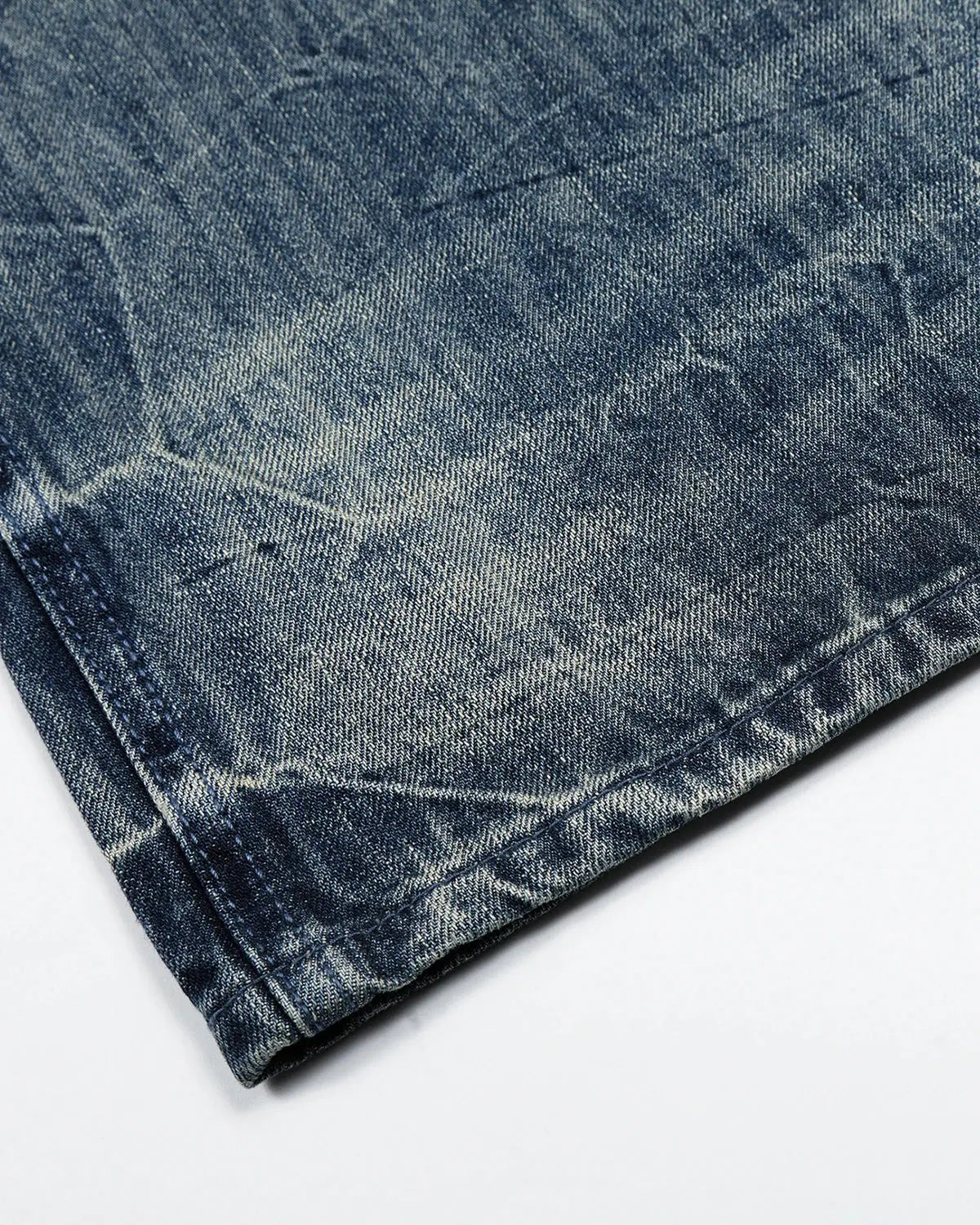 Inflation Streetwear textured wash baggy jeans with relaxed fit, featuring a faded denim look and distressed details.