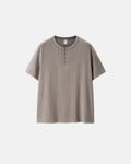 Old Money Relaxed Henley T-Shirt by INFLATION, casual short-sleeve shirt with buttoned neckline, in a neutral color.