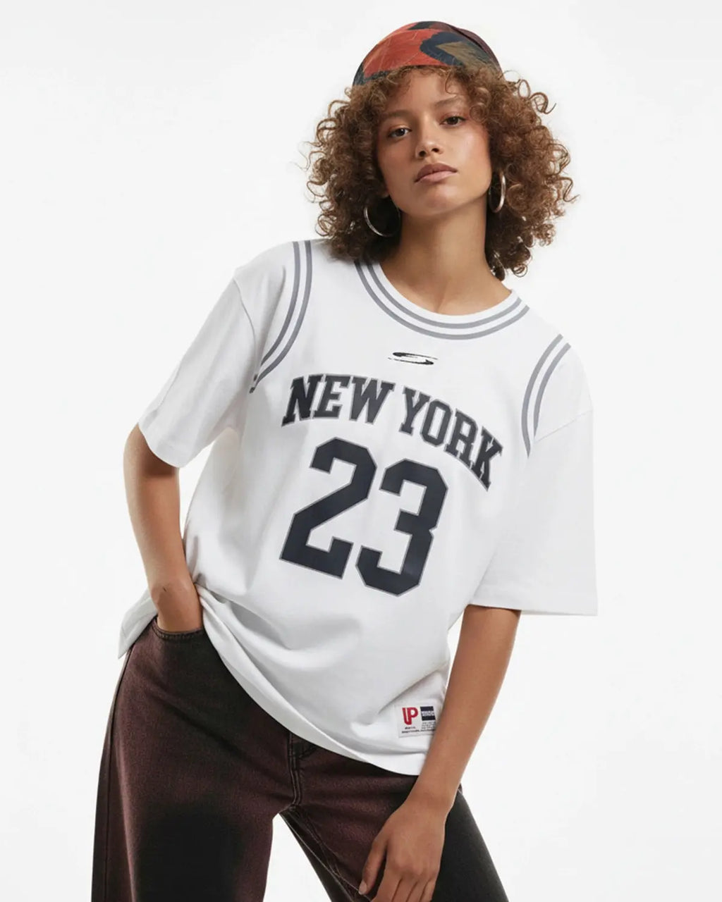 Inflation Streetwear Mock Neck 23 New York Jersey, close-up of black jersey fabric with mock neck design and brand logo detail.