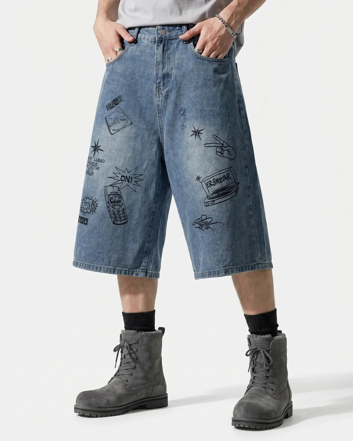 Washed graffiti-style longline jorts by INFLATION, denim pants with distressed details and a relaxed streetwear fit.