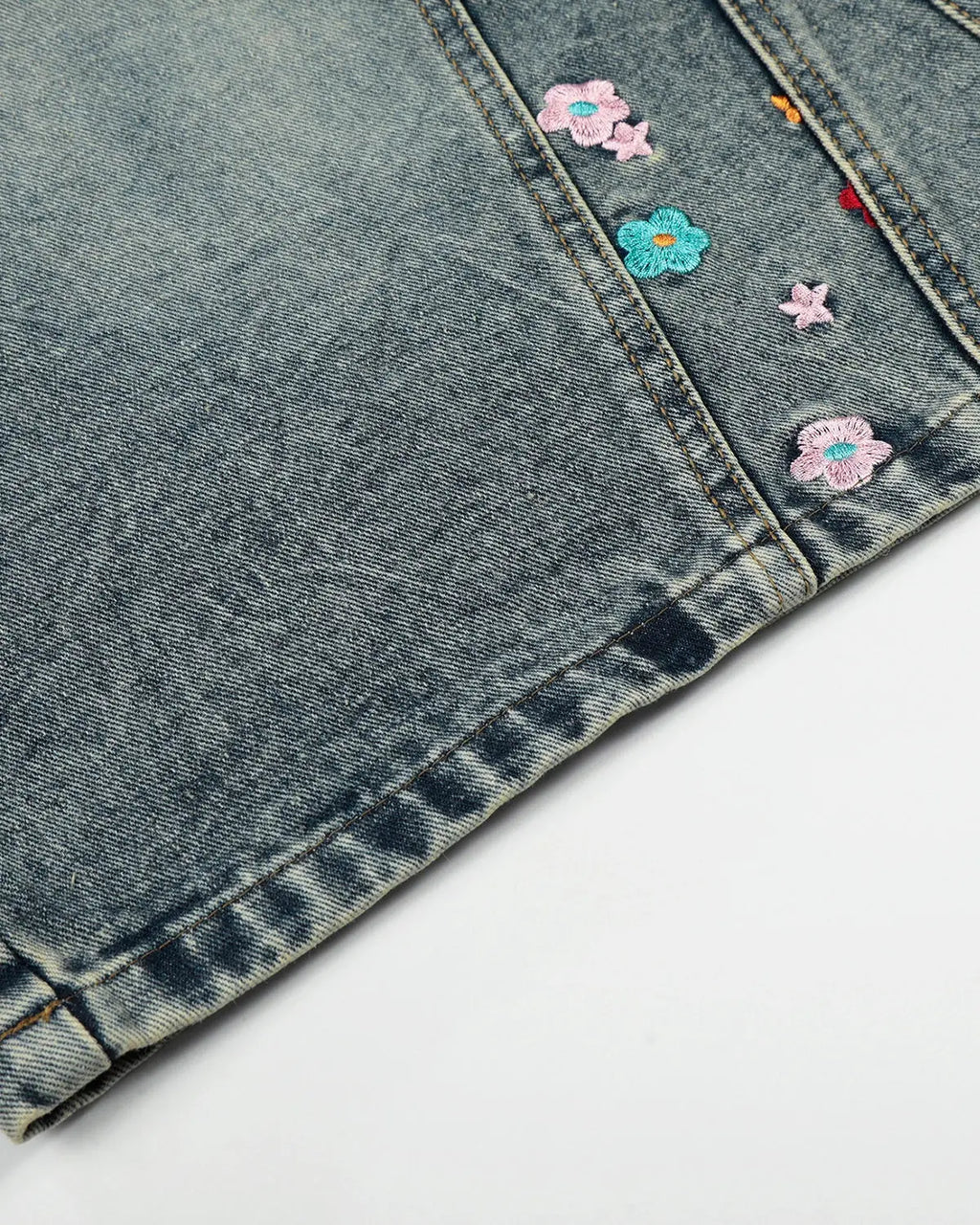 Inflation floral embroidered long baggy jorts pants with colorful floral embroidery and relaxed fit, streetwear style.