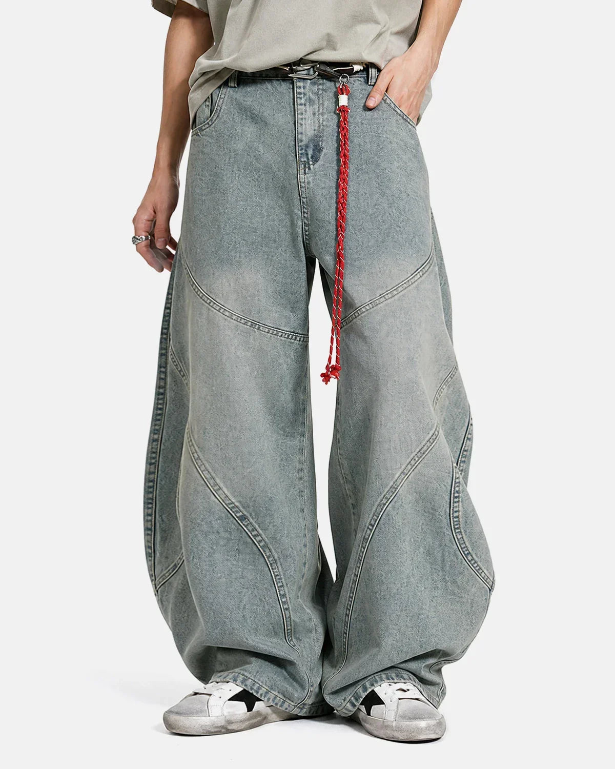 Acid wash baggy jeans with visible stitching from Inflation Streetwear, featuring a relaxed fit and distressed denim style.