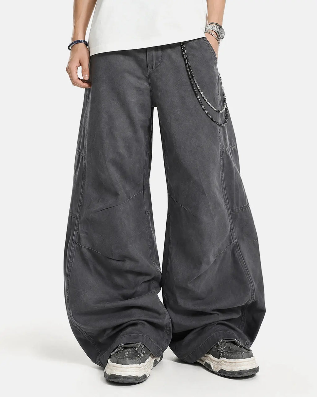 Washed curved seam cargo pants by INFLATION, featuring a relaxed fit, multiple pockets, and curved seam details.