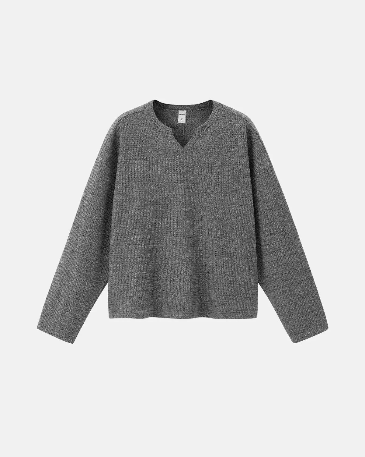 Inflation Streetwear V-neck long sleeve waffle T-shirt in neutral color, close-up of textured fabric and fit.