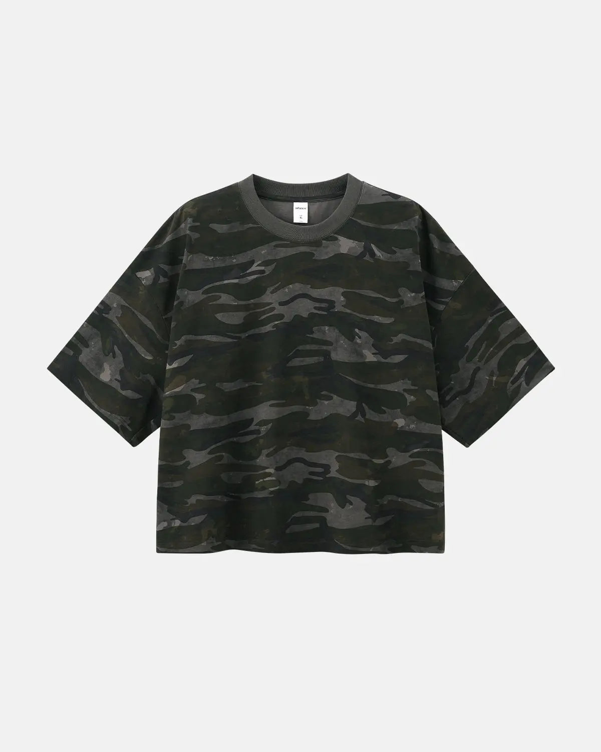Boxy camo T-shirt by INFLATION featuring a relaxed fit and camouflage pattern, styled with casual streetwear vibe.