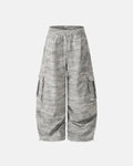 Camouflage cargo barrel pants by INFLATION featuring multiple pockets and a relaxed streetwear style.