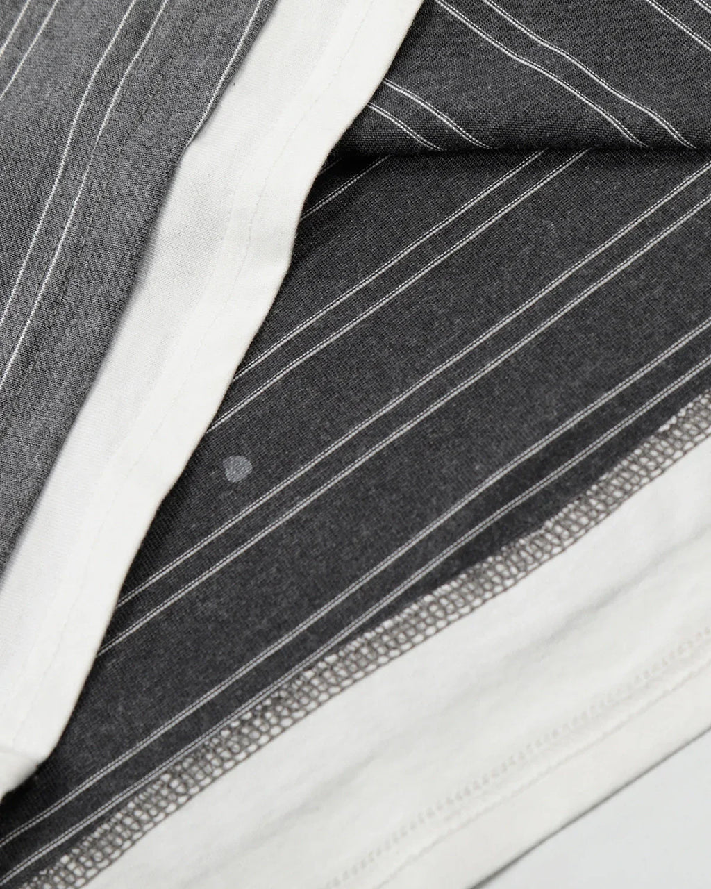 Layered Henley Stripe T-Shirt by INFLATION, featuring a casual striped design with layered neckline and relaxed fit.