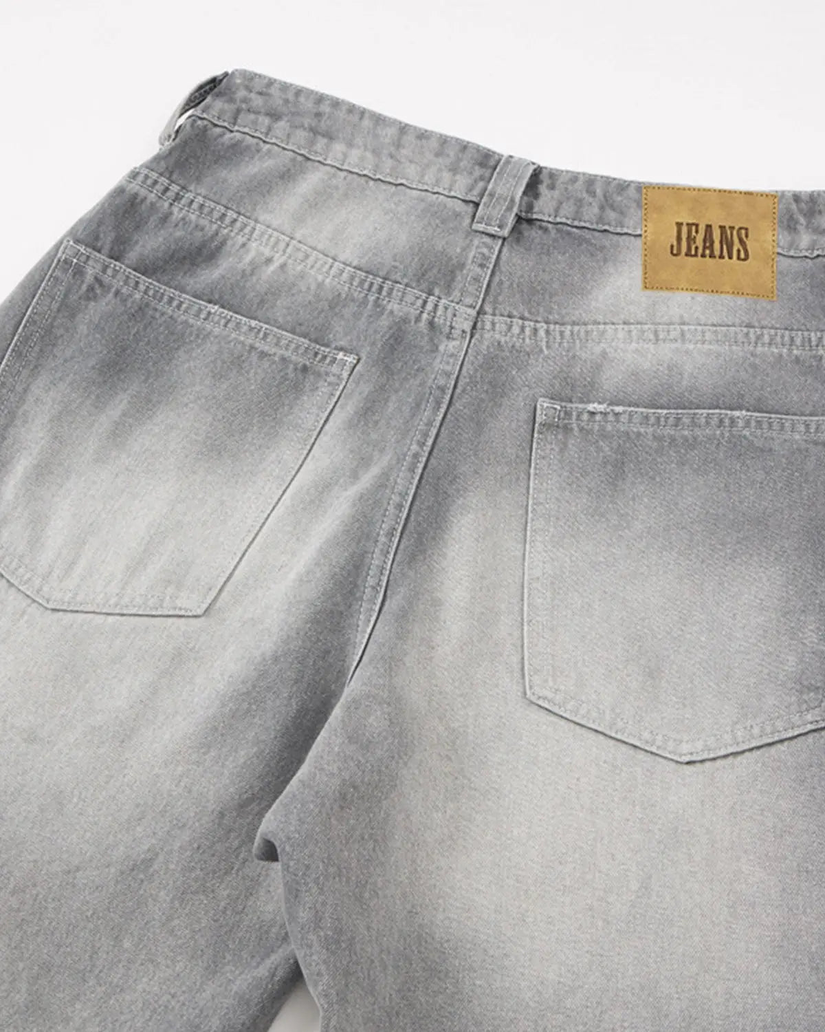Blue acid wash barrel jeans from INFLATION Streetwear, showcasing relaxed fit and distressed denim style.