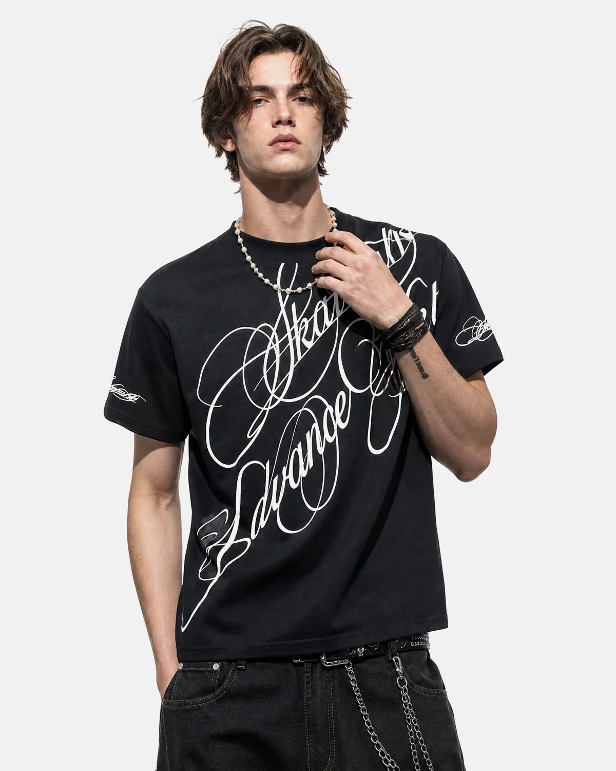 Inflation Streetwear all-over script graphic T-shirt featuring bold printed text on a casual black T-shirt, front view.