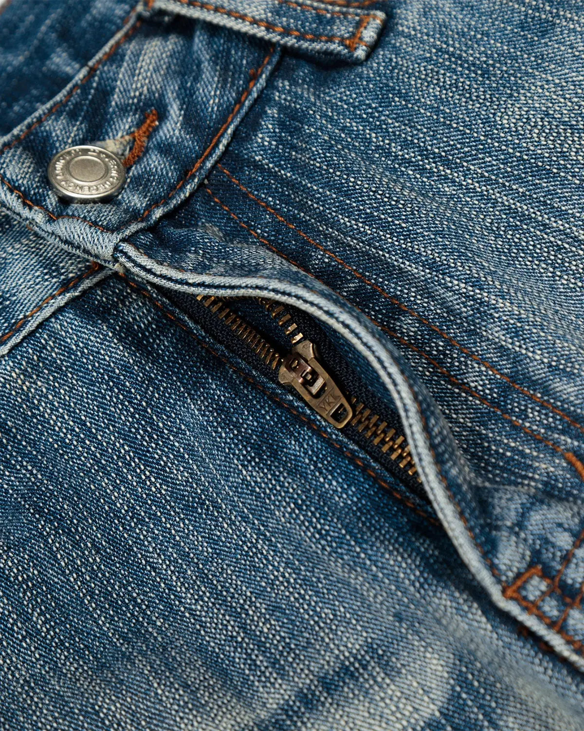 Acid wash whisker bamboo weave jeans by INFLATION, showing distressed denim with whisker details and a relaxed fit.