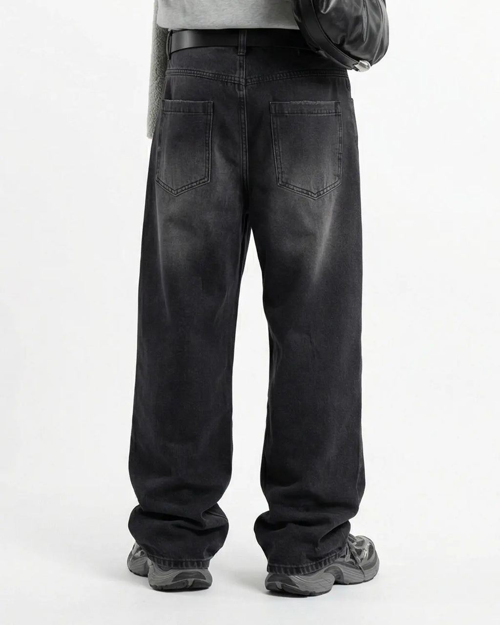 Distressed rhinestone ripped baggy jeans from Inflation Streetwear featuring torn fabric and sparkling rhinestone details.