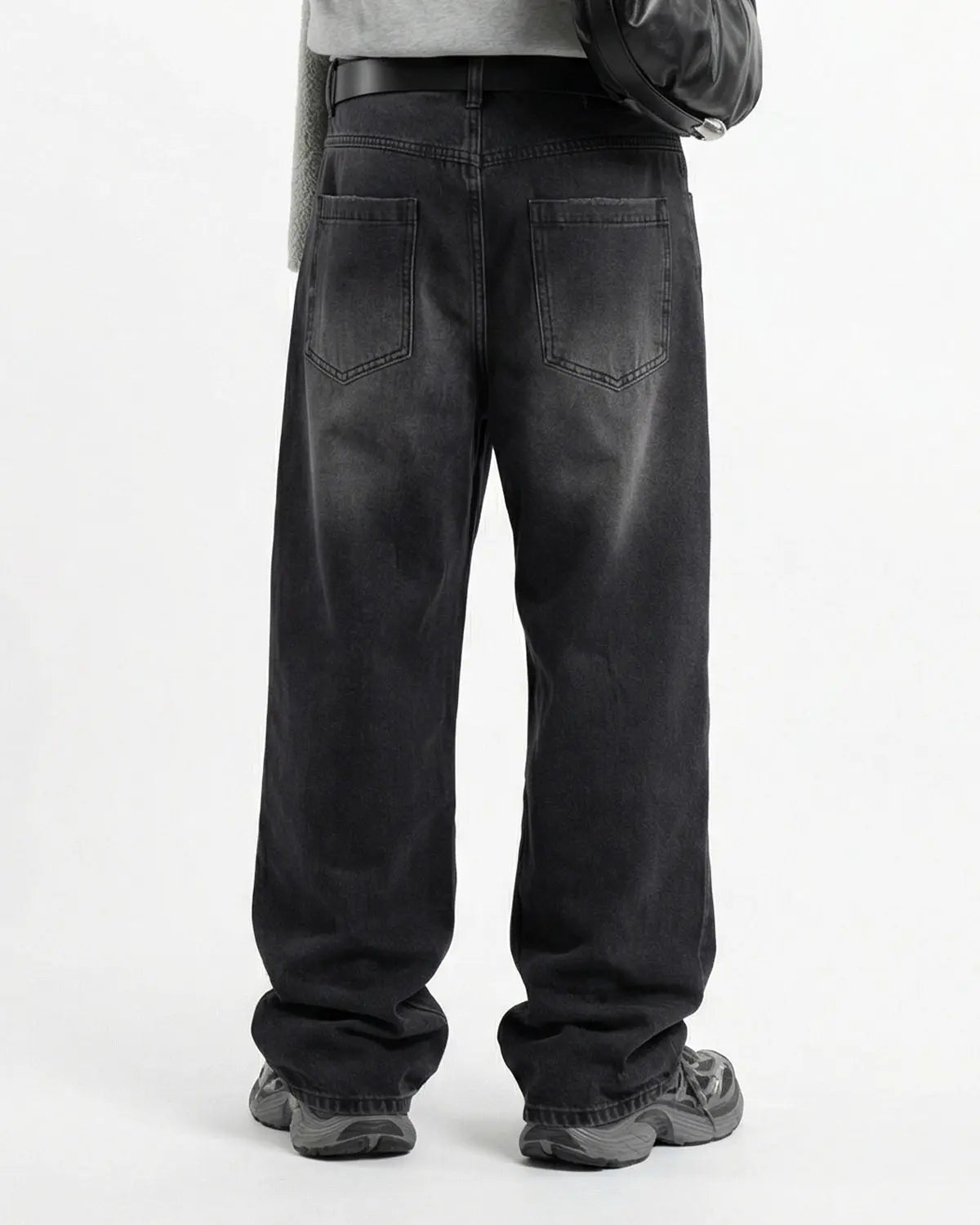 Distressed rhinestone ripped baggy jeans from Inflation Streetwear featuring torn fabric and sparkling rhinestone details.