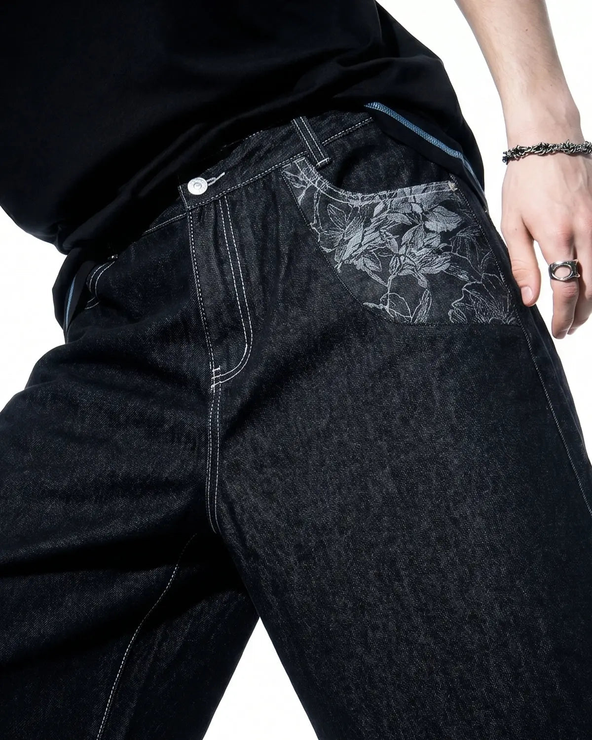 Inflation brand baggy denim jorts with embroidered pocket, casual streetwear pants featuring relaxed fit and detailed stitching.