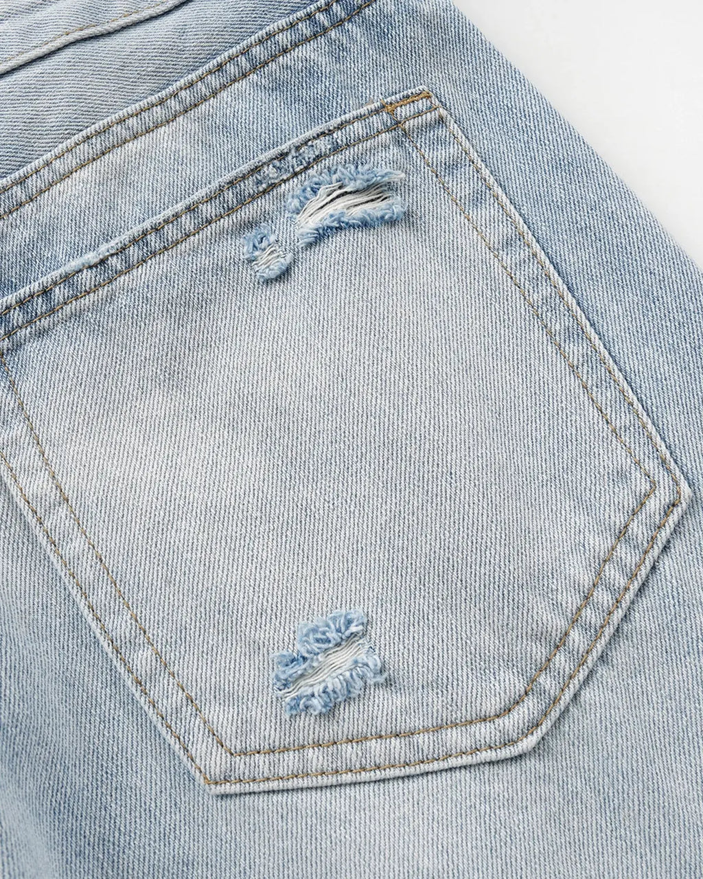 Inflation Double Waist Distressed Baggy Jeans with ripped details and relaxed fit, worn by a model showcasing streetwear style.
