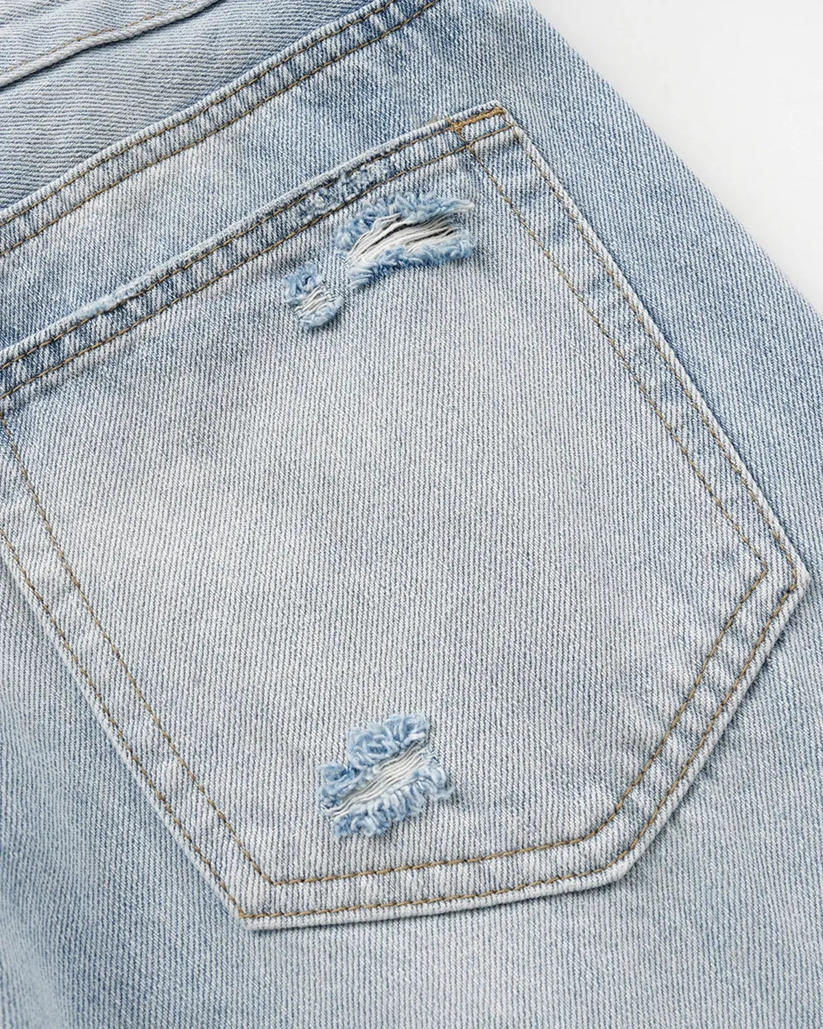 Inflation Double Waist Distressed Baggy Jeans with ripped details and relaxed fit, worn by a model showcasing streetwear style.