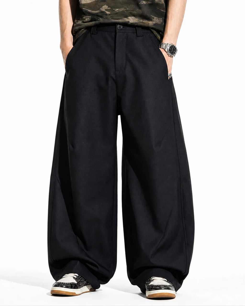 Inflation streetwear pleated barrel tailored pants in neutral fabric with a high waist and tailored fit, shown on a model.