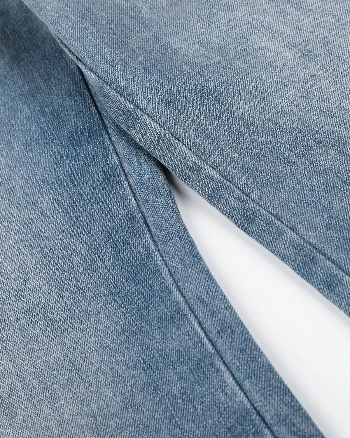 Dark blue Star Pocket Bootcut Jeans by INFLATION showing back pockets and relaxed fit on a mannequin.