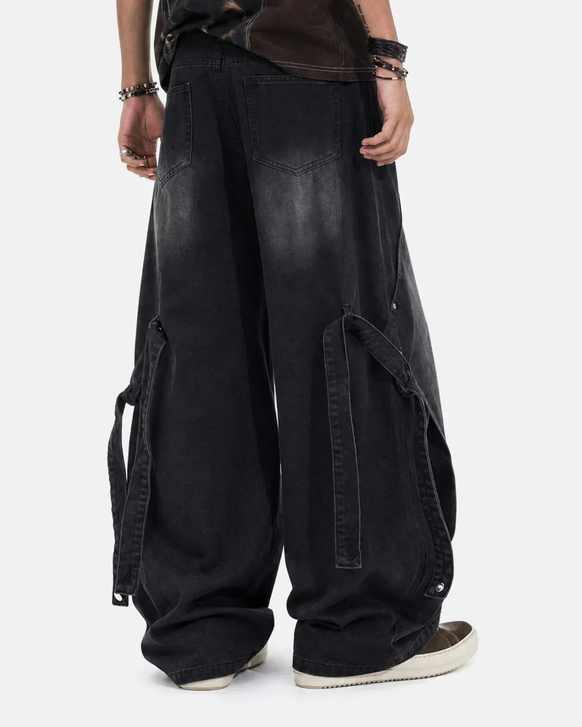 Inflation streetwear washed straight-leg jeans with adjustable straps, shown on a model, casual denim style with a relaxed fit.