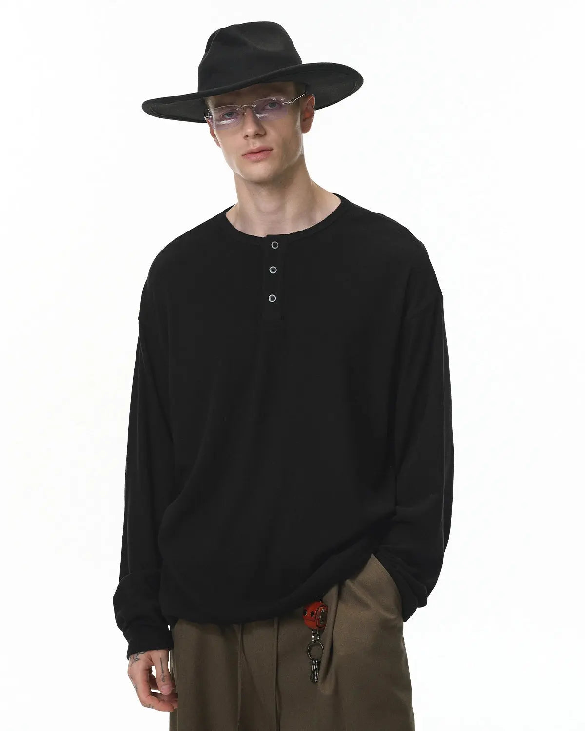 Inflation Streetwear Henley collar long sleeve T-shirt, casual men's tee with buttoned neckline and fitted silhouette.