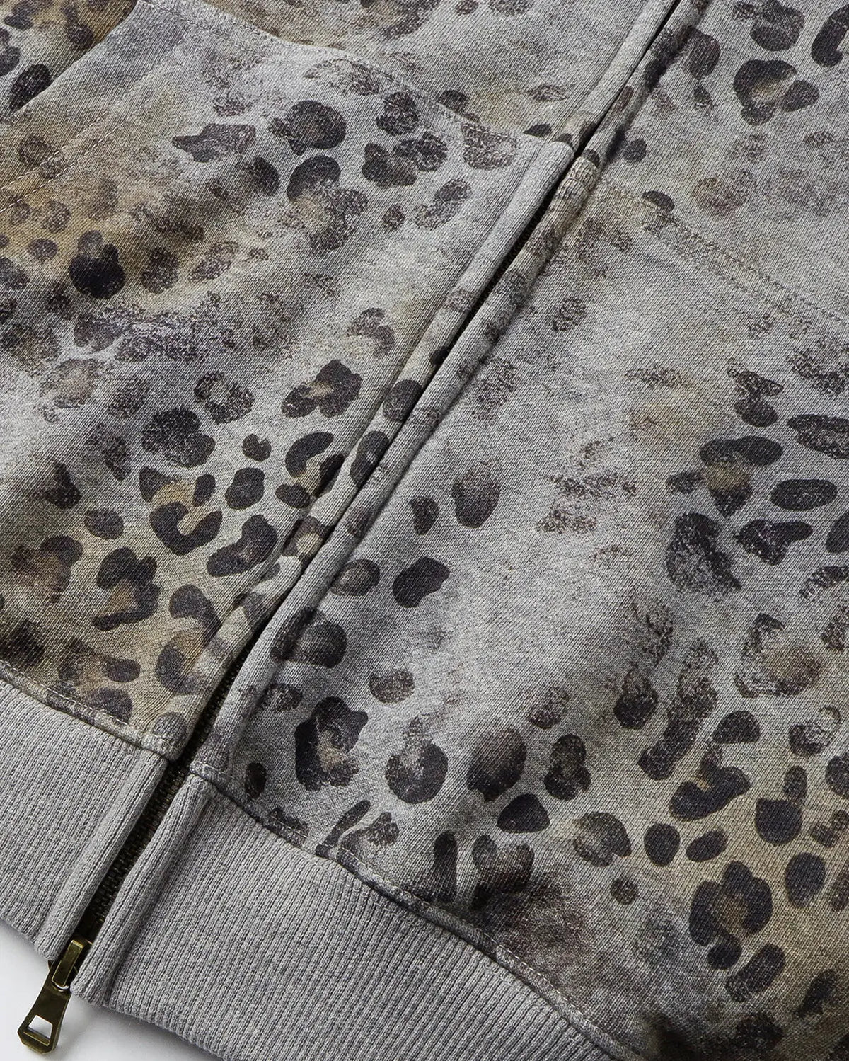 Leopard print boxy zip-up hoodie by INFLATION, featuring a front zipper, hood, and bold animal pattern on soft fabric.
