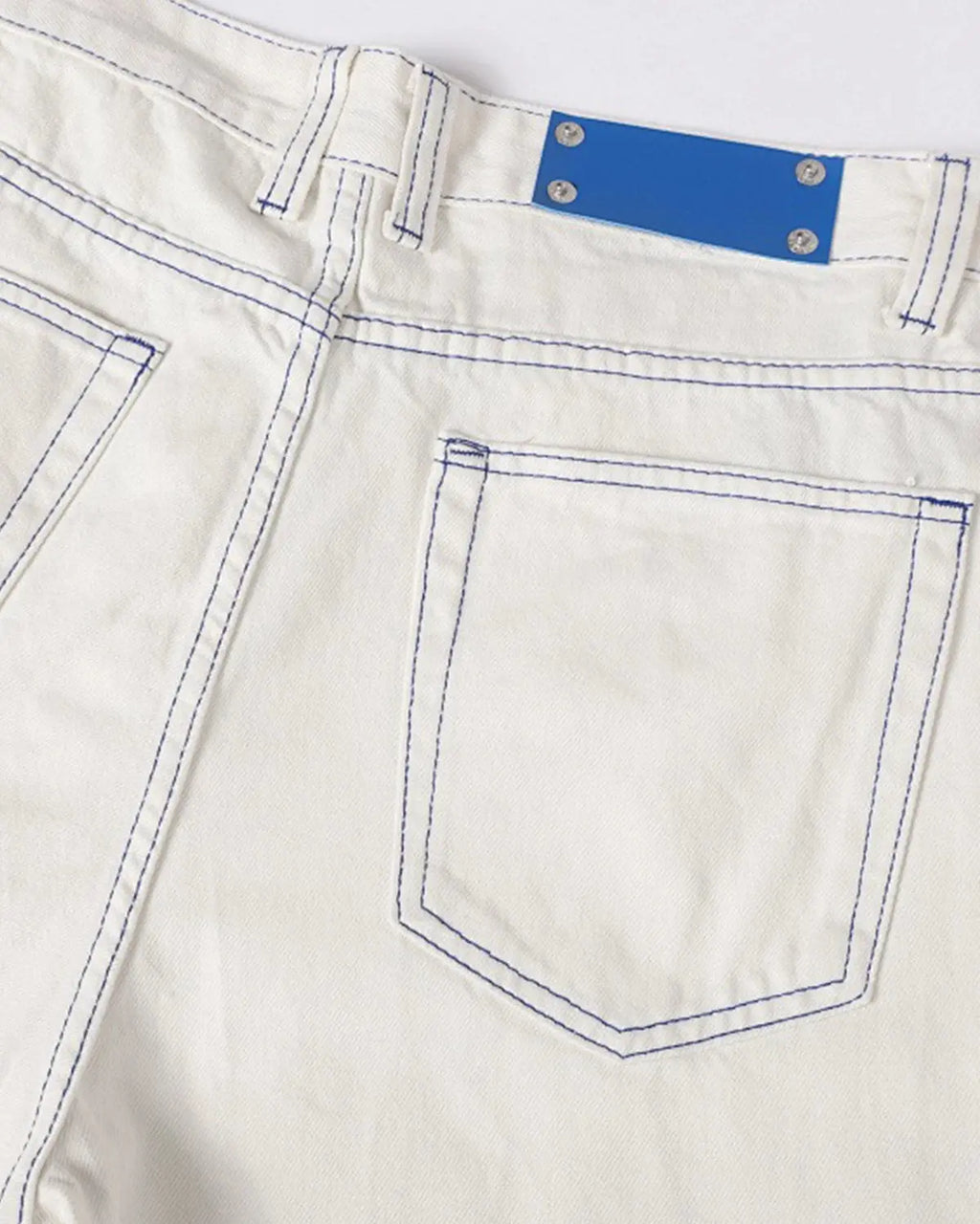 Baggy jeans with contrast stitching from Inflation Streetwear, showing the relaxed fit and stylish detailing in denim fabric.