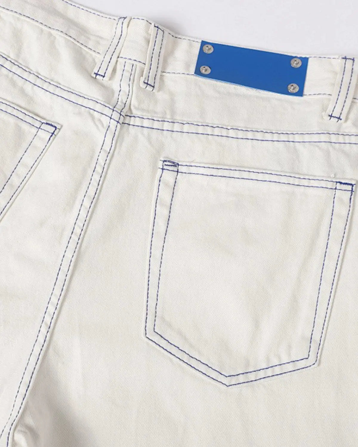 Baggy jeans with contrast stitching from Inflation Streetwear, showing the relaxed fit and stylish detailing in denim fabric.
